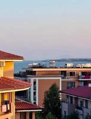 a view of buildings with the ocean in the background at Sorrento Sole Mare Sveti Vlas in Sveti Vlas