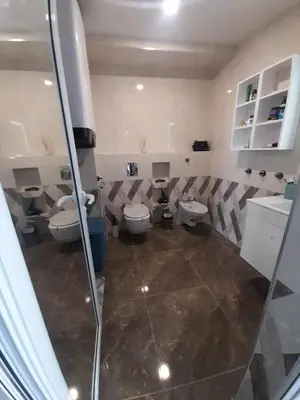 a bathroom with two toilets and a shower at Luxe 1 Monte Carlo Suite in Obzor