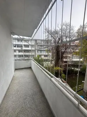 an empty balcony of a building with windows at Ssenyange Sea Garden Apartment in Varna City