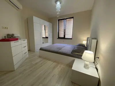 a large bedroom with a bed and a kitchen at Апартамент в затворен комплекс Артур гр Свети Влас in Sveti Vlas