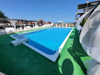 a swimming pool on the roof of a building at Complex Exotica in Lozenets
