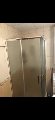 a shower stall with a glass door in a bathroom at Siana3 in Sveti Vlas