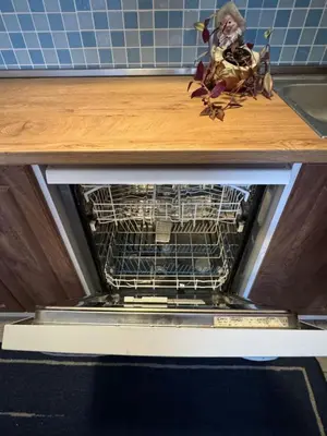 a dishwasher with a dish rack inside of it at Galateya in Varna City