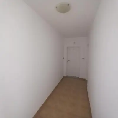 an empty room with a white wall and a door at Home Comfort in Sunny Beach