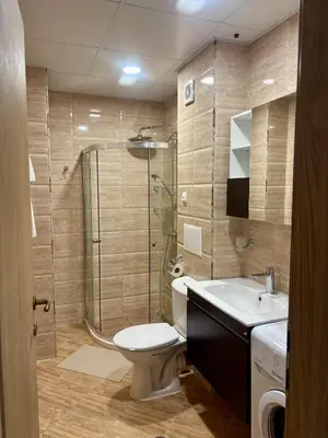 a bathroom with a toilet and a shower and a sink at Luxury in Sveti Vlas
