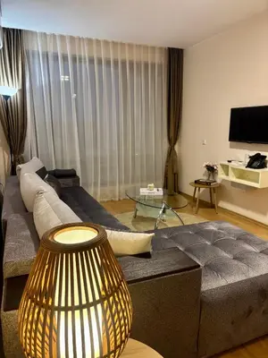 a living room with a couch and a table at Luxury in Sveti Vlas