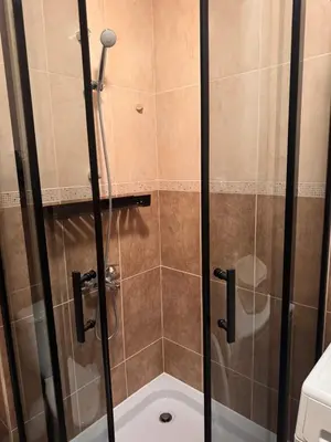 a shower with a glass door in a bathroom at Studio Sea Breeze Sveti Vlas ap58 in Sveti Vlas