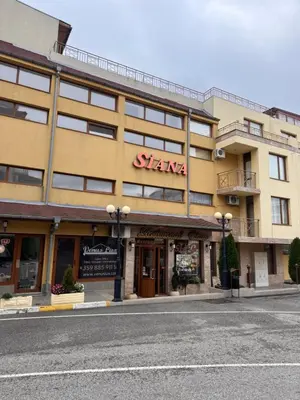 a building with a sign on the front of it at Studio Sea Breeze Sveti Vlas ap58 in Sveti Vlas