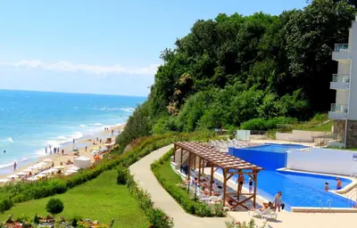 a resort with a beach and a swimming pool at Апартаменти Бяла Клиф - Byala Cliff Apartments in Byala