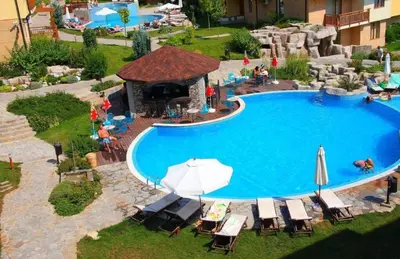 an overhead view of a swimming pool with chairs and umbrellas at Garden of Eden - Panorama C15 Rey&Mar in Sveti Vlas