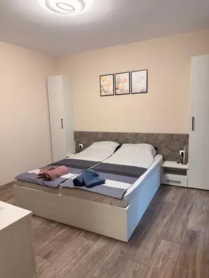 a bedroom with a bed in a room at Danny Apartment Welcomes You in Burgas City
