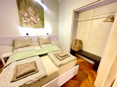 a small bedroom with a bed and a window at 'Tide Frame' Apartment - Big, Super Central, 2 bathrooms in Burgas City