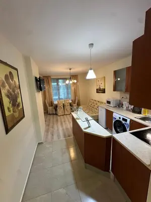 a large kitchen with a living room and a kitchen at Apartment near the sea in Pomorie