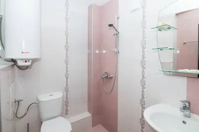 a bathroom with a shower and a toilet and a sink at Relax in Lazur - Georgi Baev Str in Burgas City