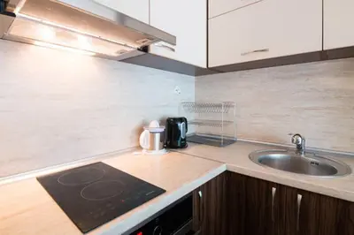 a kitchen with a sink and a counter top at Relax in Lazur - Georgi Baev Str in Burgas City