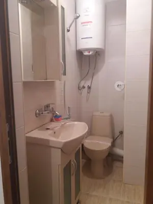 a bathroom with a sink and a toilet at Студио Наде in Tsarevo