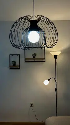 a room with a lamp and a light fixture at Atelier Pepi in Varna City