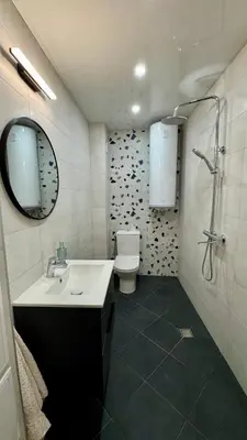 a bathroom with a sink and a toilet and a mirror at Atelier Pepi in Varna City