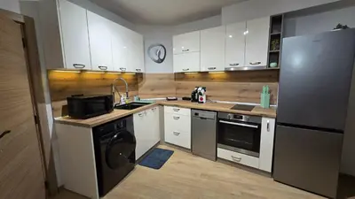 a kitchen with a refrigerator and a dishwasher at Atelier Pepi in Varna City