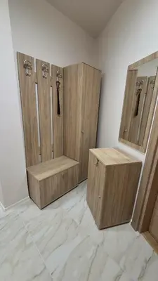 a room with three wooden hangers in a room at Atelier Pepi in Varna City
