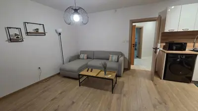 a living room with a couch and a table at Atelier Pepi in Varna City
