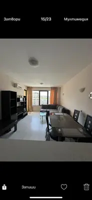 a view of a living room with a couch and a tv at Апартаменти Нино 1 in Sozopol