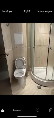 a bathroom with a toilet and a shower at Апартаменти Нино 1 in Sozopol