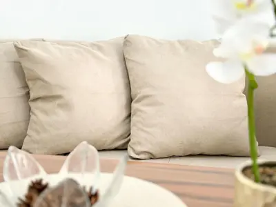a couch with two pillows and a table with a table at SeaSide 2BR Central apartment in Varna City