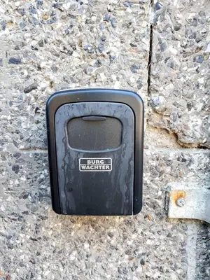 a black tv sitting on the side of a stone wall at Guest Rooms Ilko in Varna City
