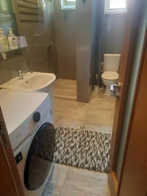 a bathroom with a sink and a toilet at Guest Rooms Ilko in Varna City