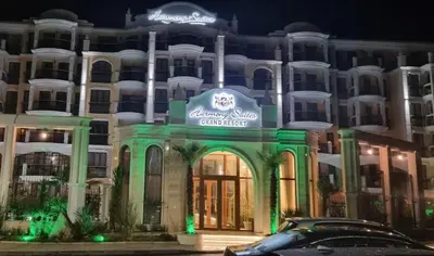 a building with a sign on the front of it at Harmony Grand Resort 16 Private Apartment 214 in Sunny Beach