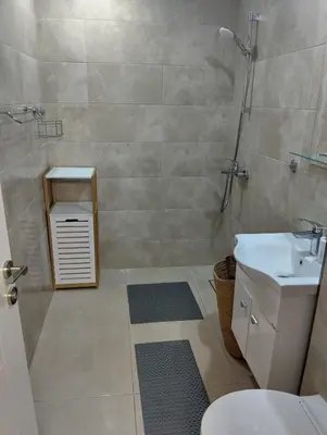 a bathroom with a shower and a toilet and a sink at Emperium, Style, Coziness and tranquility by the sea in Sveti Vlas! in Sveti Vlas