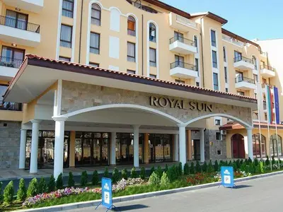 a hotel building with a royal sun sign in front of it at Spacious apartment with 2 bedrooms and 2 bathrooms complex ROYAL SUN Sunny beach in Sunny Beach
