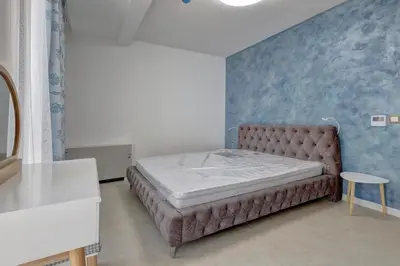 a bedroom with a large bed in a room at Central Luxury One Bedroom in Varna in Varna City