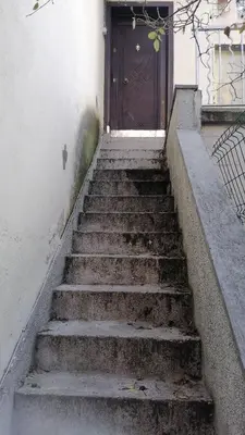 a set of stairs leading to a door at Апартамент 27 юли 1 in Varna City