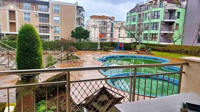 a view of a pool from a balcony with buildings at Complex-Lesso in Ravda