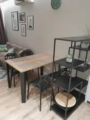 a table and a shelf in a living room at Garden of Eden- MintGarden- Sveti Vlas in Sveti Vlas