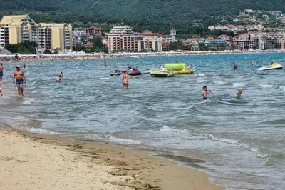 a group of people in the water at the beach at ROYAL BEACH HOTEL apartment SEA G in Sunny Beach