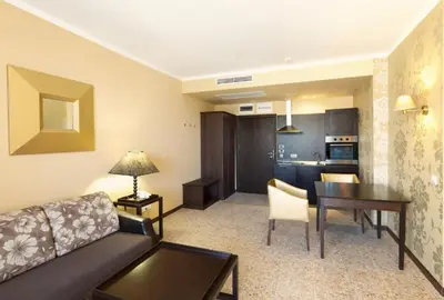 a living room with a couch and a table at ROYAL BEACH HOTEL apartment SEA G in Sunny Beach