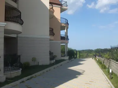 a sidewalk in front of a building at South Beach Apartments in Obzor
