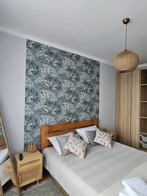a bedroom with a bed with a wall mural at Garden of Eden- MintGarden- Sveti Vlas 1 in Sveti Vlas