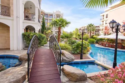 a bridge over a swimming pool in a resort at Harmony Suites-4 Private Apartment B544 in Sunny Beach
