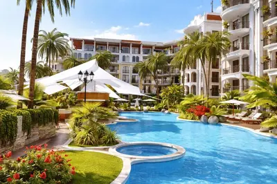 a resort swimming pool with palm trees and buildings at Harmony Suites-4 Private Apartment B544 in Sunny Beach