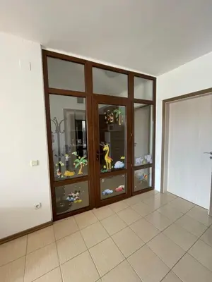 an empty room with a large glass display case at Flat on the beach in Chernomorets