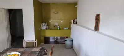 a room with a table and a yellow wall at Polonia - KEMNI in Burgas City