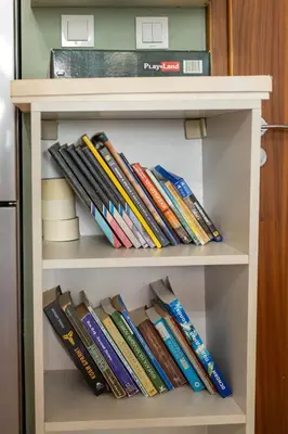 a book shelf filled with lots of books at Bright City-Center Flat for 4 Guests in Varna City