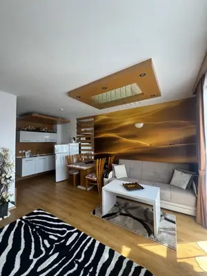 a living room with a couch and a table at Cozy studio in Sanny Beach in Sunny Beach