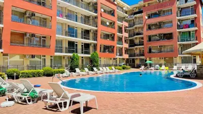 a swimming pool in the middle of an apartment complex at Sunset Beach 3 - Menada Apartments in Sunny Beach