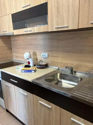 a kitchen with a sink and a counter top at Soleil Bleu in Nesebar