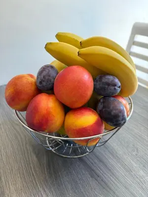 a bowl of fruit sitting on a table at Soleil Bleu in Nesebar